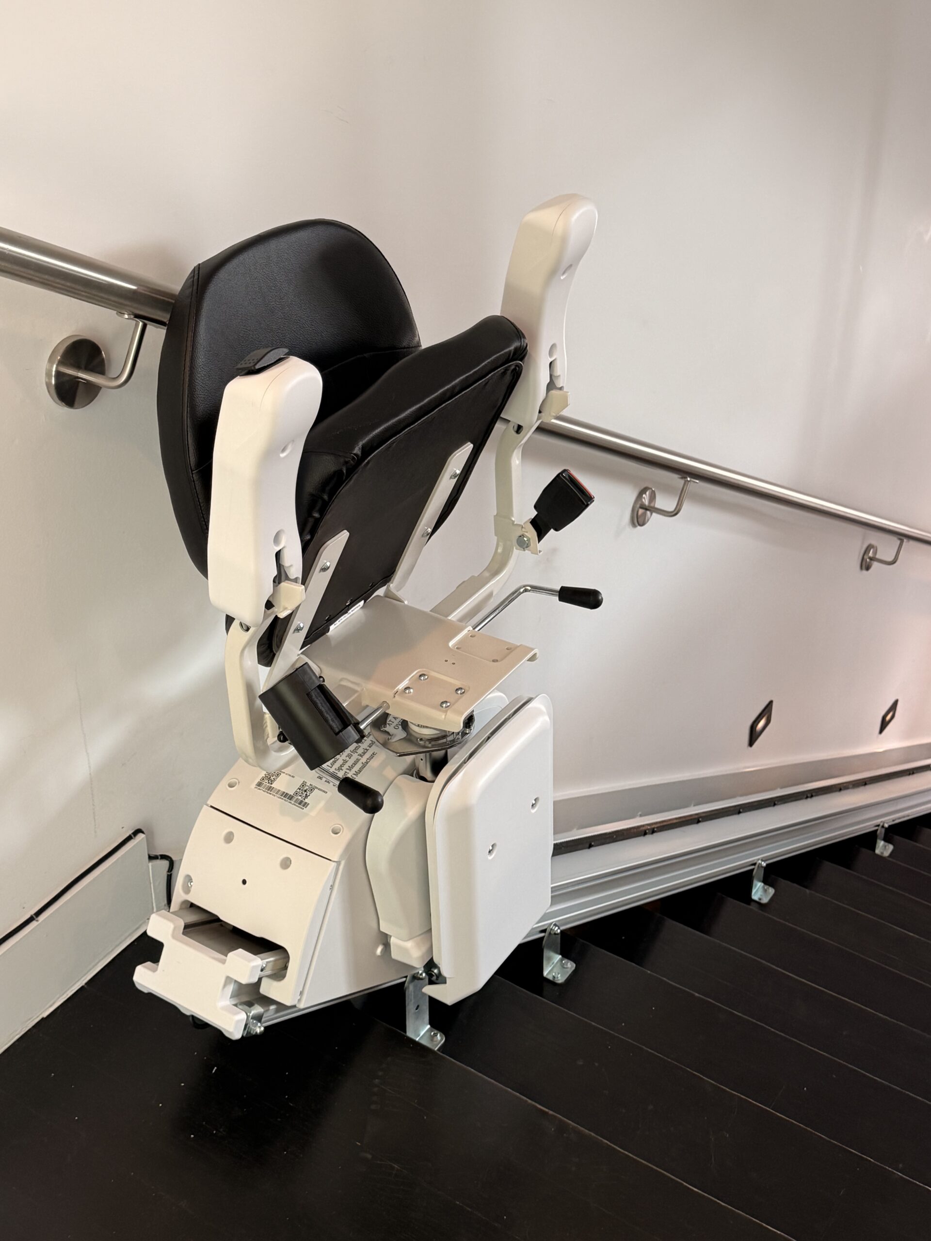 The Pilot Aviator E603 Straight Stairlift with Dark Brown Upholstery in 45° swivel position