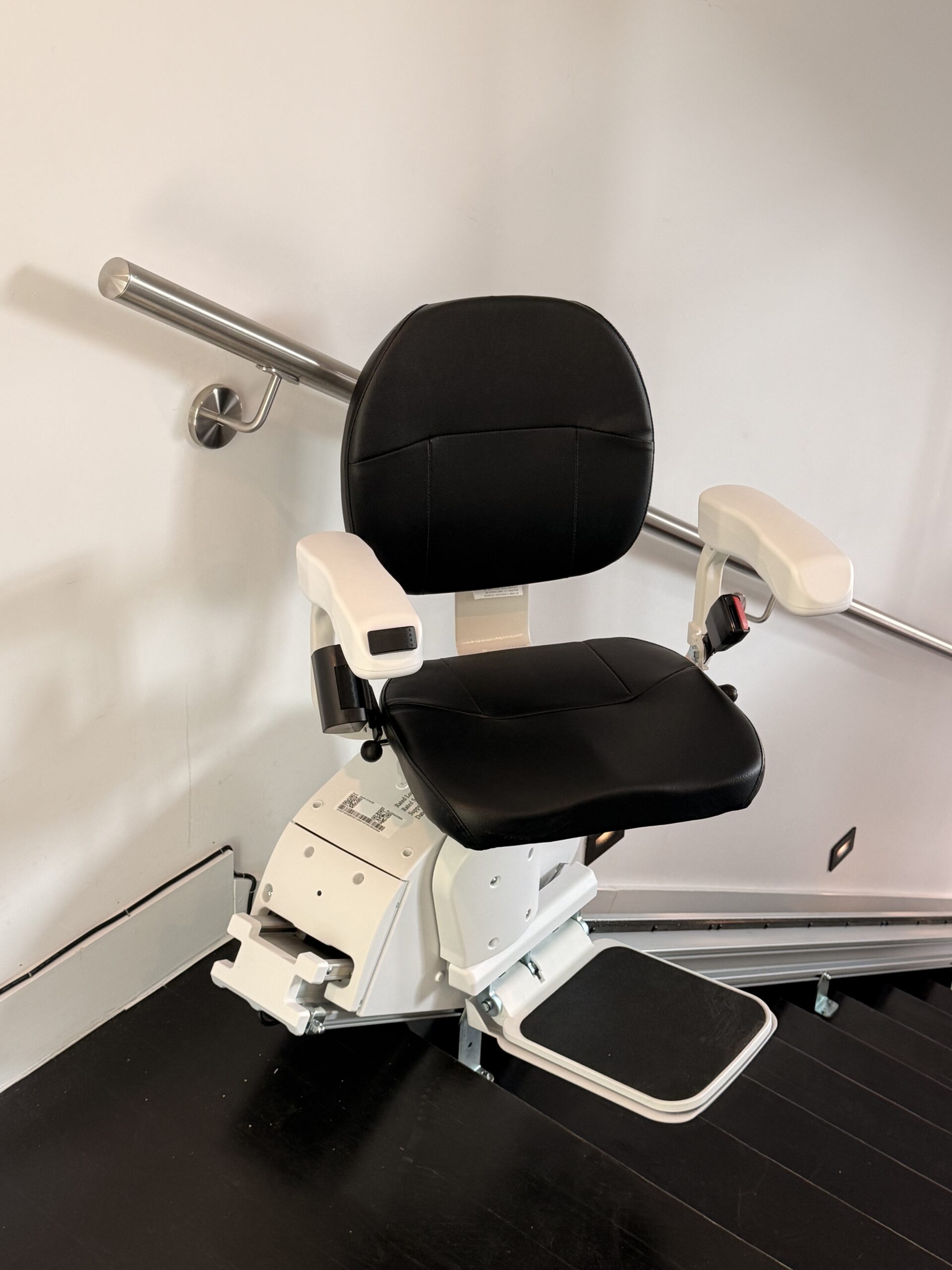 The Pilot Aviator E603 Straight Stairlift with Dark Brown Upholstery in 45° swivel position