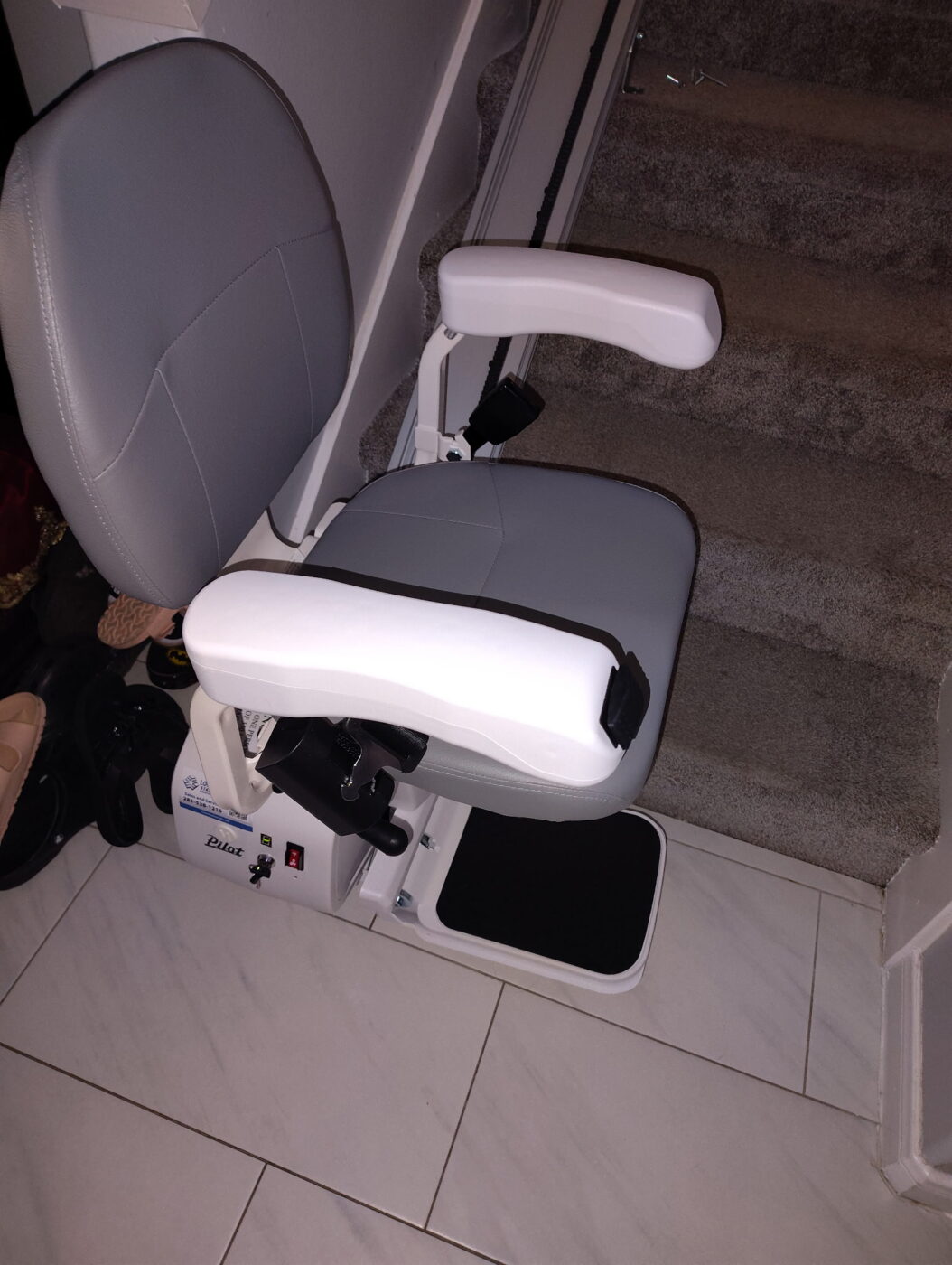 The Pilot Aviator E603 Straight Stairlift with Dark Brown Upholstery in 45° swivel position